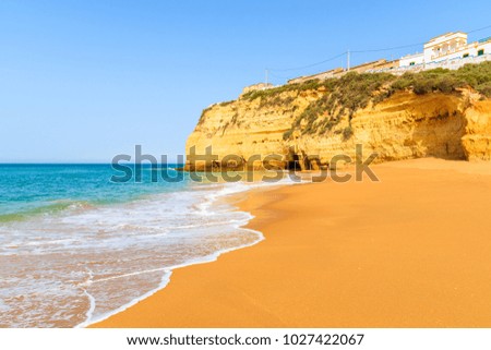View of beautiful sandy beach in Carvoeiro town, Algarve, Portugal