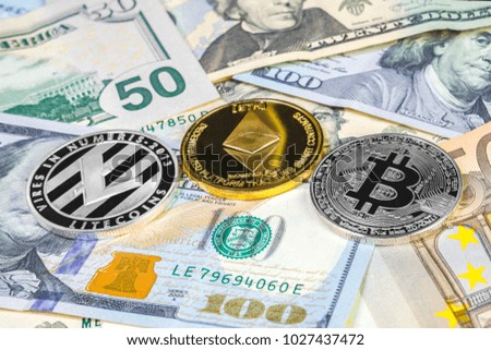 Bitcoin, litecoin and ethereum coin on dollar and euro bills. Cryptocurrency background