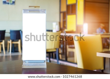 Mock up Blank white menu frame on cafe restaurant table