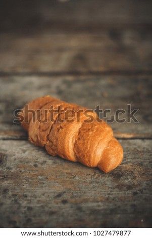 croissant on a wooden surface