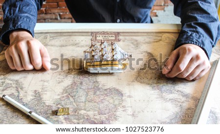 Boat on map , toy boat on a geographical map background