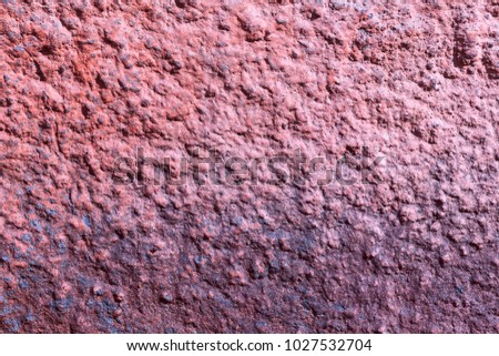 The texture of the plastered facing of the stone surface of the wall background.