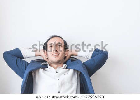 Business man is sitting relaxing on white background