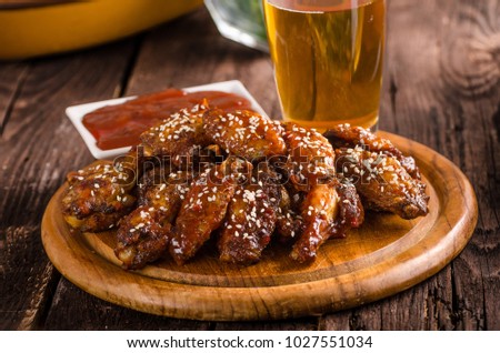 Grilled chicken wings with hot sauce. food photography, ready for advertisment