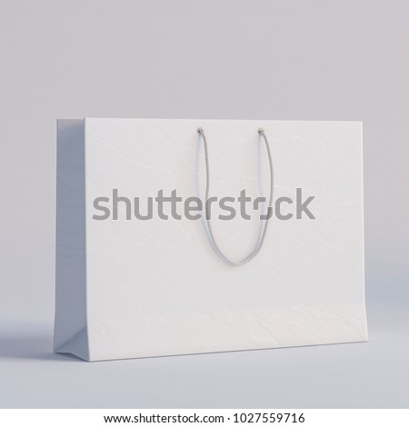 Luxury white paper bag on a white background. Royalty-Free Stock Photo #1027559716