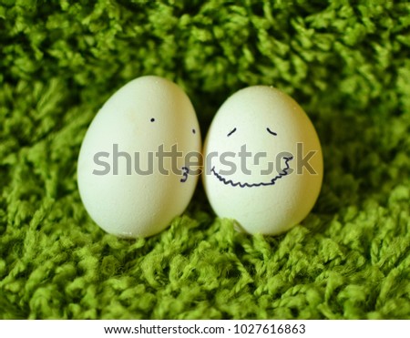 Funny easter eggs on a green grass.