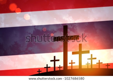 Grave crosses on the background of the flag Thailand