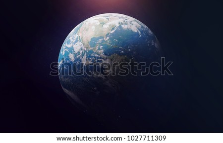 Planet Earth view from outer space. Black background. Sun glow on the top. Elements of this image furnished by NASA