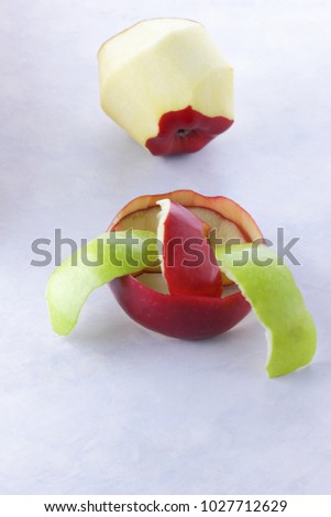 Red pepper, red and peeled green apple on white background, isolated, copy space, apple skim, vegetarian food, hot pepper, pop art, peeled green apple