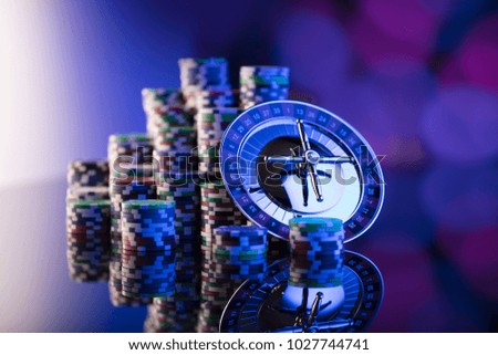Casino. High contrast image of casino roulette. Poker chips. Bokeh background 
