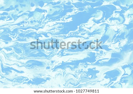 Colorful wet abstract paint leaks and splashes texture on white watercolor paper background. Natural organic shapes and design.