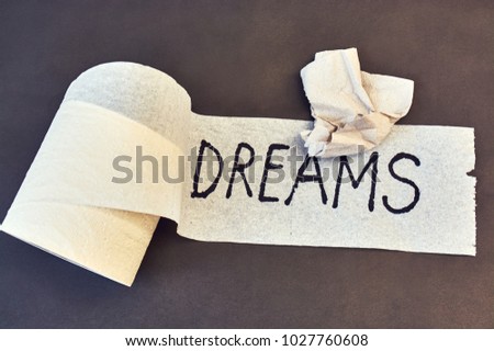 inscription on a toilet paper of "dreams"
