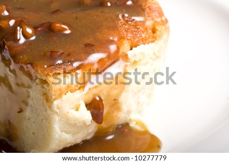fresh hot bread pudding topped with caramel syrup and pecans Royalty-Free Stock Photo #10277779