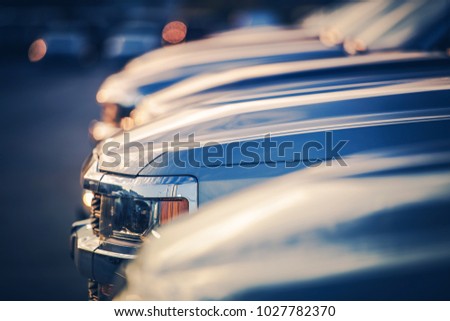 New Vehicles in Dealer Stock. Shallow Depth of Field Closeup Photo. Automotive Industry.