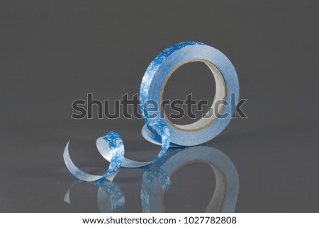 roll of ribbons for bows on a gray background