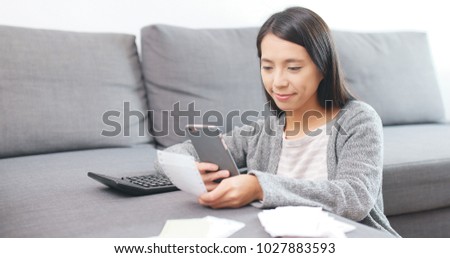 Woman counting expense of daily life 
