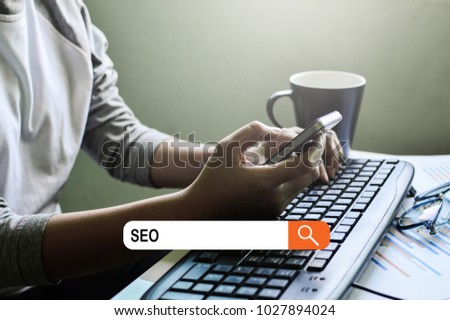 SEO Concept, Business women financial inspector and secretary making report, and search SEO word on search engine for make a website