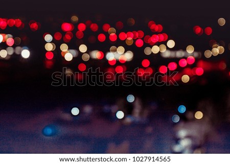 Blur bokeh , red round circles of a evening night city. Motion unfocused image , copyspace photo, background image of the european town. 