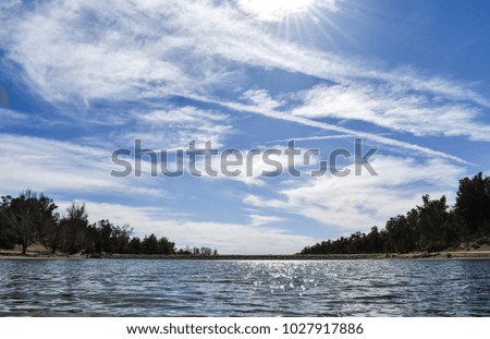 The sky reflecting on a lake Royalty-Free Stock Photo #1027917886