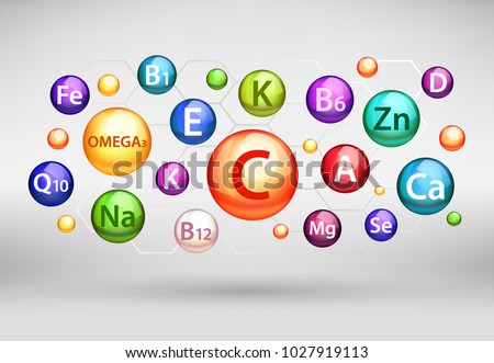 Essential vitamin and mineral complex. Vector creative design with different color glossy vitamin pills capsules. Royalty-Free Stock Photo #1027919113