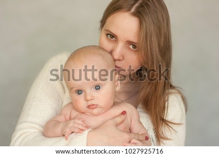motherhood concept. mom and baby. mom kisses a child