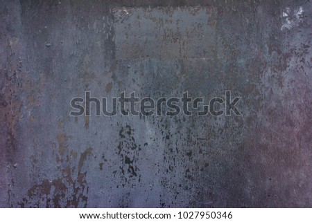 Old, rusty metal surface. Grunge dark background. Close-up photo 