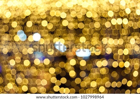 Gold lights bokeh defocus abstract background. Golden Festive Christmas. Glitter bright background.