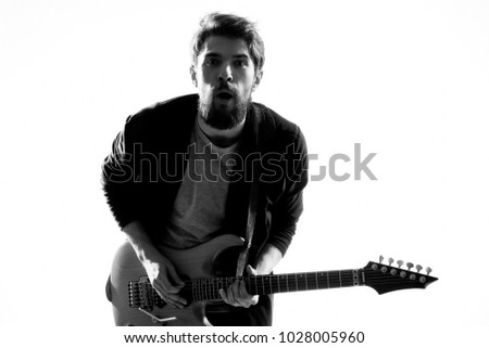 musician with electric guitar, black and white photo