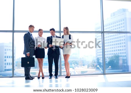 Group of business people doing presentation with laptop during meeting. Group of business people