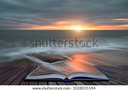 Creative book image of Beautiful sunset landscape image of Burton Bradstock golden cliffs in Dorest England