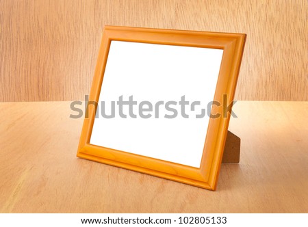 Photo frames on the table and wood background