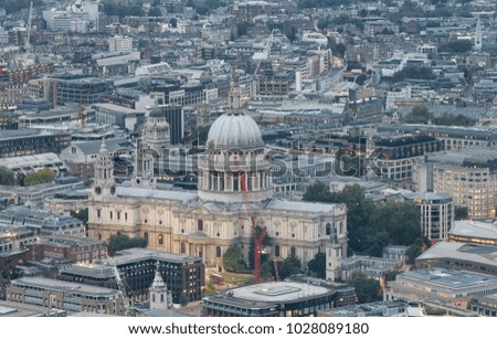 Aerial view of St Paul and city skyline at night, London.