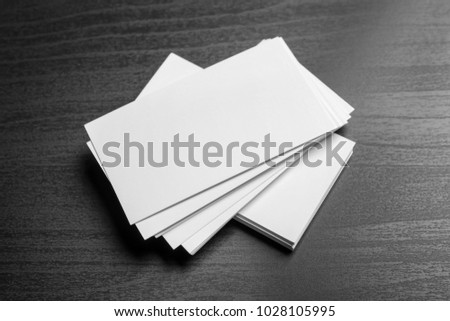 Blank business cards on dark background