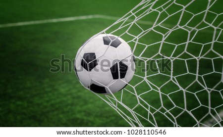 Soccer ball on goal with net and green background, this photo can use for football, sport, goal, score, shoot and target of business concept Royalty-Free Stock Photo #1028110546