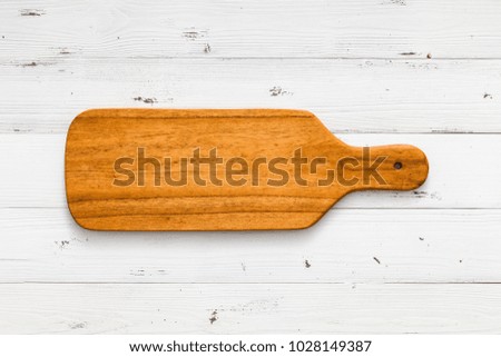 Handmade wooden cutting board on white board