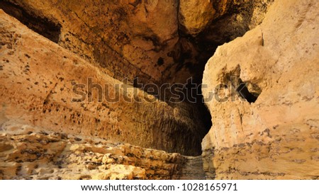 Sandstone cave in Etretat cliffs, Normandy, France