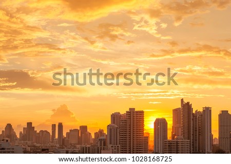 Modern high building in Bangkok city, Thailand. Cityscape at sunset in summer. Business city center with warm sky. Picture for add text message. Backdrop for design art work.