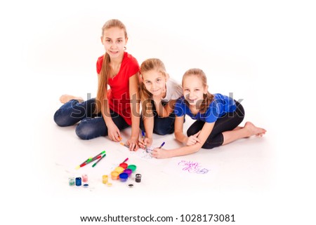 Happy kids drawing isolated on white. Team work, creativity concept.