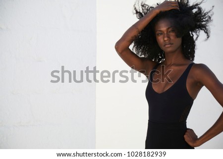 Beautiful young woman in black vest, portrait