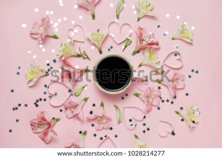Cup of coffee in a center of flower composition. Spring magic picture. top view, flat lay