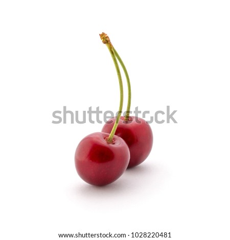 Photo of red beautiful cherries with tails isolated on white background