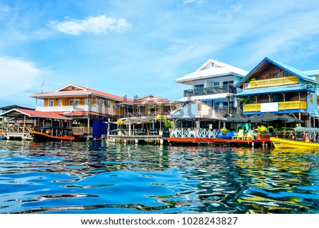 Houses of typical construction on the sea in Bocas del Toro, Panama. Royalty-Free Stock Photo #1028243827