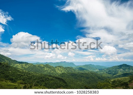 Aerial view landscape of tree, mountain from the top of mountain on blue sky with cloud