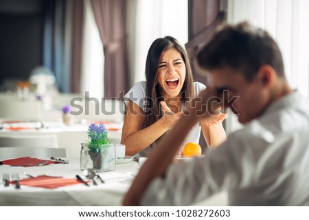 Screaming woman arguing.Judging stressed female having a nervous breakdown.Defending opinion.Fighting for rights.Panic attack.Negative event reaction.Bullying,verbal violence.Accusing,showing anger Royalty-Free Stock Photo #1028272603