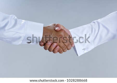 Saudi Arab Businessmen Hands Shaking, Making Agreement and Welcoming Closeup Royalty-Free Stock Photo #1028288668