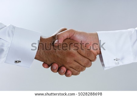 Saudi Arab Businessmen Hands Shaking, Making Agreement and Welcoming Closeup Royalty-Free Stock Photo #1028288698