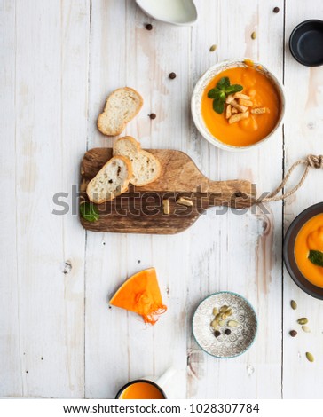 Soup, cream of pumpkin served with roasted seeds and croutons.