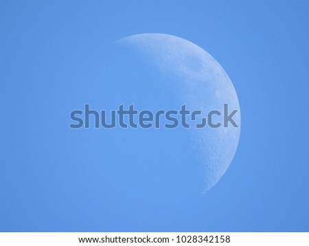 Daytime moon close up.