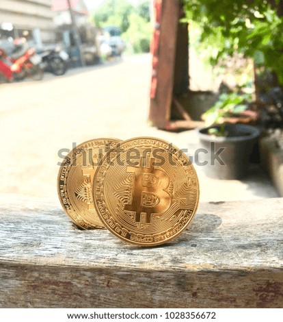 Bitcoin On a wood floor background blurred