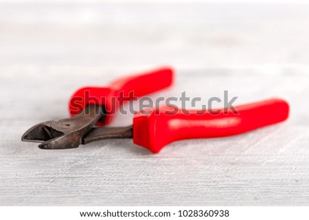 Stock picture of tools and screws on a wooden background